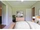 Bedroom featuring furniture, a modern dresser, and artwork, filled with natural light at 5167 Hiram Lithia Springs Rd, Powder Springs, GA 30127