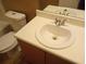 Cozy bathroom featuring a toilet, sink, and vanity at 8202 Fairington Village Dr, Lithonia, GA 30038