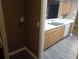 Spacious kitchen featuring a pass-through, white countertops and stainless steel sink at 8202 Fairington Village Dr, Lithonia, GA 30038