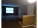 Inviting living room with a large window for natural light and neutral carpeting at 8202 Fairington Village Dr, Lithonia, GA 30038