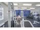 Community gym with workout equipment including weight machines, treadmills, and bright lighting at 1150 Collier Nw Rd # K9, Atlanta, GA 30318