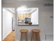 Cozy kitchen view featuring a breakfast bar and modern appliances at 1150 Collier Nw Rd # K9, Atlanta, GA 30318