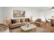 Elegant living room featuring a plush sofa, stylish decor, and ample natural light at 1150 Collier Nw Rd # K9, Atlanta, GA 30318