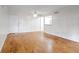 Bright living room with hardwood floors and an open view into the kitchen area at 1150 Collier Nw Rd # K9, Atlanta, GA 30318