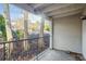 Covered outdoor patio offers space for relaxing with trees at 1150 Collier Nw Rd # K9, Atlanta, GA 30318