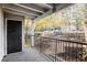 Covered patio area with black metal railings and exterior access at 1150 Collier Nw Rd # K9, Atlanta, GA 30318
