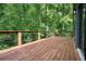 Large back deck overlooking a lush, wooded yard with mature trees at 3427 Mill Stream Sw Ln, Marietta, GA 30060