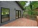 Wooden back deck with gray siding and wooded view at 3427 Mill Stream Sw Ln, Marietta, GA 30060