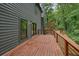 Wooden back deck of gray home overlooks treed lot at 3427 Mill Stream Sw Ln, Marietta, GA 30060