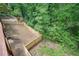 An aerial view of a fenced back yard with lush woods at 3427 Mill Stream Sw Ln, Marietta, GA 30060
