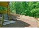 Sloped backyard featuring concrete steps and a wooden fence at 3427 Mill Stream Sw Ln, Marietta, GA 30060