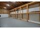 Unfinished basement with storage shelving and gray concrete floors at 3427 Mill Stream Sw Ln, Marietta, GA 30060