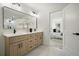 Tastefully designed bathroom with double vanity and views into the main bedroom at 3427 Mill Stream Sw Ln, Marietta, GA 30060