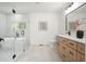 Modern bathroom featuring wood cabinets, a soaking tub, and a glass-enclosed shower at 3427 Mill Stream Sw Ln, Marietta, GA 30060