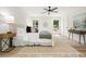 Bright bedroom with a ceiling fan, large windows, stylish rug, and neutral decor at 3427 Mill Stream Sw Ln, Marietta, GA 30060