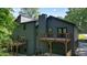 Exterior of a modern home with a deck and a well-maintained yard at 3427 Mill Stream Sw Ln, Marietta, GA 30060