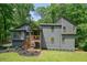 Charming two-story home featuring gray siding, wood porch and a beautifully landscaped yard at 3427 Mill Stream Sw Ln, Marietta, GA 30060