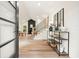 Welcoming foyer boasts an open staircase, modern decor, and views of the spacious living area with a fireplace at 3427 Mill Stream Sw Ln, Marietta, GA 30060