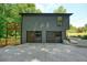 Detached two car garage with modern doors and adjacent upper level deck at 3427 Mill Stream Sw Ln, Marietta, GA 30060