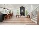 Bright open-concept living space with a modern kitchen, dining area, and a cozy seating area with a fireplace at 3427 Mill Stream Sw Ln, Marietta, GA 30060