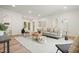 Open living room with wood floors, recessed lighting, neutral colors, and access to outdoor space at 3427 Mill Stream Sw Ln, Marietta, GA 30060
