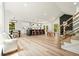 Bright open-concept living space with a modern kitchen, dining area, and a cozy seating area with a fireplace at 3427 Mill Stream Sw Ln, Marietta, GA 30060
