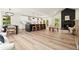 Bright open-concept living space with a modern kitchen, dining area, and a cozy seating area with a fireplace at 3427 Mill Stream Sw Ln, Marietta, GA 30060