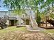 Multi-level deck with stairs with nice landscaping and inviting outdoor entertaining spaces at 3988 Church View Ln, Suwanee, GA 30024