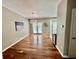 Dining area with hardwood floors, modern light fixture, and sliding glass doors to the patio at 3988 Church View Ln, Suwanee, GA 30024