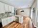 Bright kitchen with hardwood floors, stainless steel appliances and breakfast area at 3988 Church View Ln, Suwanee, GA 30024