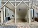 Covered brick patio with ceiling fan, perfect for outdoor entertaining, with view of stairs at 3988 Church View Ln, Suwanee, GA 30024