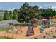 Community playground featuring swings, slides, and climbing structures, perfect for Gathering fun and recreation at 3988 Church View Ln, Suwanee, GA 30024