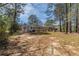 Expansive backyard featuring mature trees, an open layout, and natural sunlight at 80 Crystal River Dr, Riverdale, GA 30274