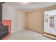 Basement area with concrete floor, vintage stove, and access to main floor at 80 Crystal River Dr, Riverdale, GA 30274