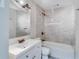 Neutral-toned bathroom features a tub, shower, and modern vanity with updated fixtures at 80 Crystal River Dr, Riverdale, GA 30274