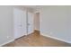 Neutral-toned bedroom with refinished floors and ample closet space at 80 Crystal River Dr, Riverdale, GA 30274