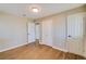 Neutral-toned bedroom with refinished floors and white trim throughout the room at 80 Crystal River Dr, Riverdale, GA 30274