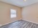 Cozy bedroom showcasing hardwood floors, neutral walls, and bright window at 80 Crystal River Dr, Riverdale, GA 30274