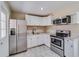 Modern kitchen featuring stainless steel appliances, white cabinets, and a bright atmosphere at 80 Crystal River Dr, Riverdale, GA 30274
