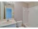 Clean white bathroom with a tiled shower and a vanity at 124 Camry Ln, Grayson, GA 30017