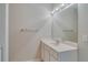 Well-lit bathroom featuring a vanity with modern fixtures, large mirror, and clean finishes, creating a functional space at 124 Camry Ln, Grayson, GA 30017