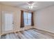 Bedroom with a ceiling fan and a window and exterior door, offering a comfortable and serene space at 124 Camry Ln, Grayson, GA 30017