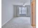 Bright bedroom with a ceiling fan, window, neutral walls, and soft carpeting at 124 Camry Ln, Grayson, GA 30017