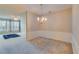 Bright dining area with chandelier open to living room, perfect for entertaining at 124 Camry Ln, Grayson, GA 30017