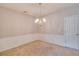 Elegant dining room featuring wainscoting and a stylish chandelier at 124 Camry Ln, Grayson, GA 30017