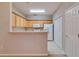Functional kitchen with light wood cabinets and essential appliances at 124 Camry Ln, Grayson, GA 30017