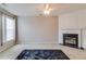 Comfortable living room boasting a fireplace, plush carpeting, and ample natural light at 124 Camry Ln, Grayson, GA 30017