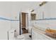 Bathroom featuring tiled floor, white fixtures and vintage accents at 5128 Lavista Rd, Tucker, GA 30084