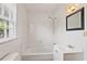 Bathroom with a window, shower and tub combo, and a sink at 5128 Lavista Rd, Tucker, GA 30084