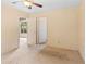 Bedroom with a fan and two doors. One door leads to a sunroom and its garden view at 5128 Lavista Rd, Tucker, GA 30084